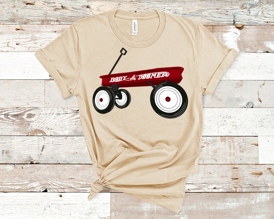 Natural color tee with a red childs wagon on it on the side of the wagon it says baby boomer