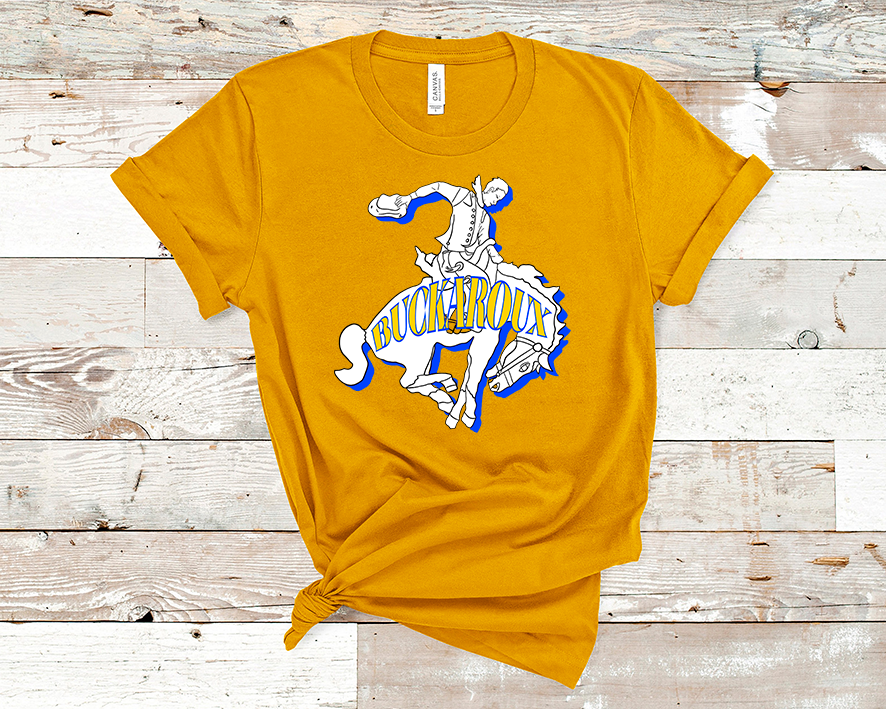 Mustard yellow tee. Graphic of a cowboy riding a bucking horse with a blue shadow and the word Buckaroux in Yellow across the horse