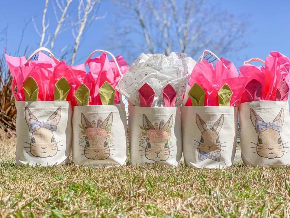 a collection of canvas easter buckets with bunny ears and various bunny graphics 