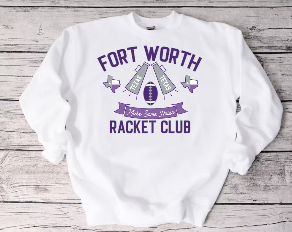 White Crew Neck Sweatshirt on a Wood Background. Sweatshirt has art that says ""Fort Worth Racket Club" the art also has a banner that says make some noise with a football, two megaphones that say Texas and two Texas Graphics. Colors are purples and grey.