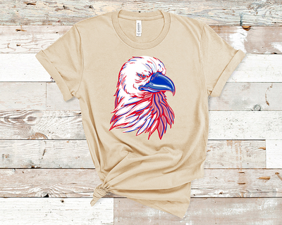 Natural Tan tee with a red, white, and blue layered eagle graphic